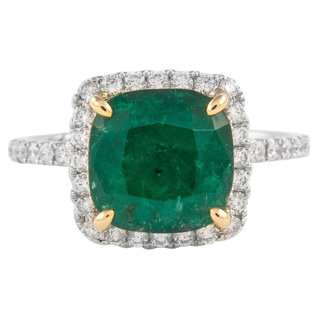 GIA Certified 3.11 Carat Emerald Diamond Halo Ring in 18k Gold: GIA Certified 3.11 Carat Emerald Diamond Halo Ring in 18k Gold This exquisite GIA certified cushion emerald and diamond halo ring boasts a stunning total gemstone weight of 3.56 carats. At its center
