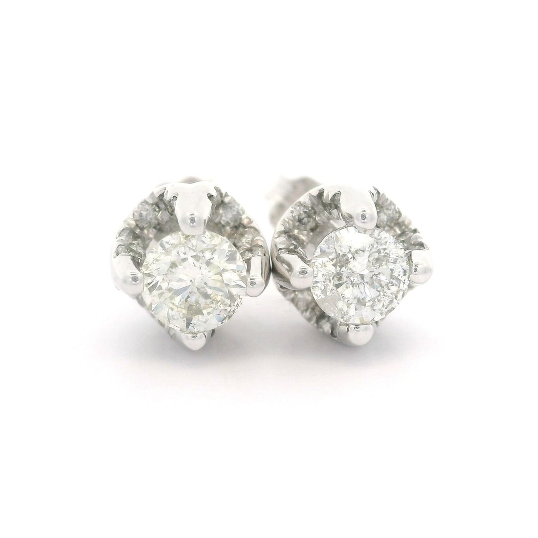 14k White Gold 1.0ctw Diamond Stud Earrings with Butterfly Closures: 14k White Gold 1.0ctw Diamond Stud Earrings with Butterfly Closures Elevate your elegance with these stunning Solid 14k White Gold Diamond Stud Earrings, featuring a total carat weight of approximatel