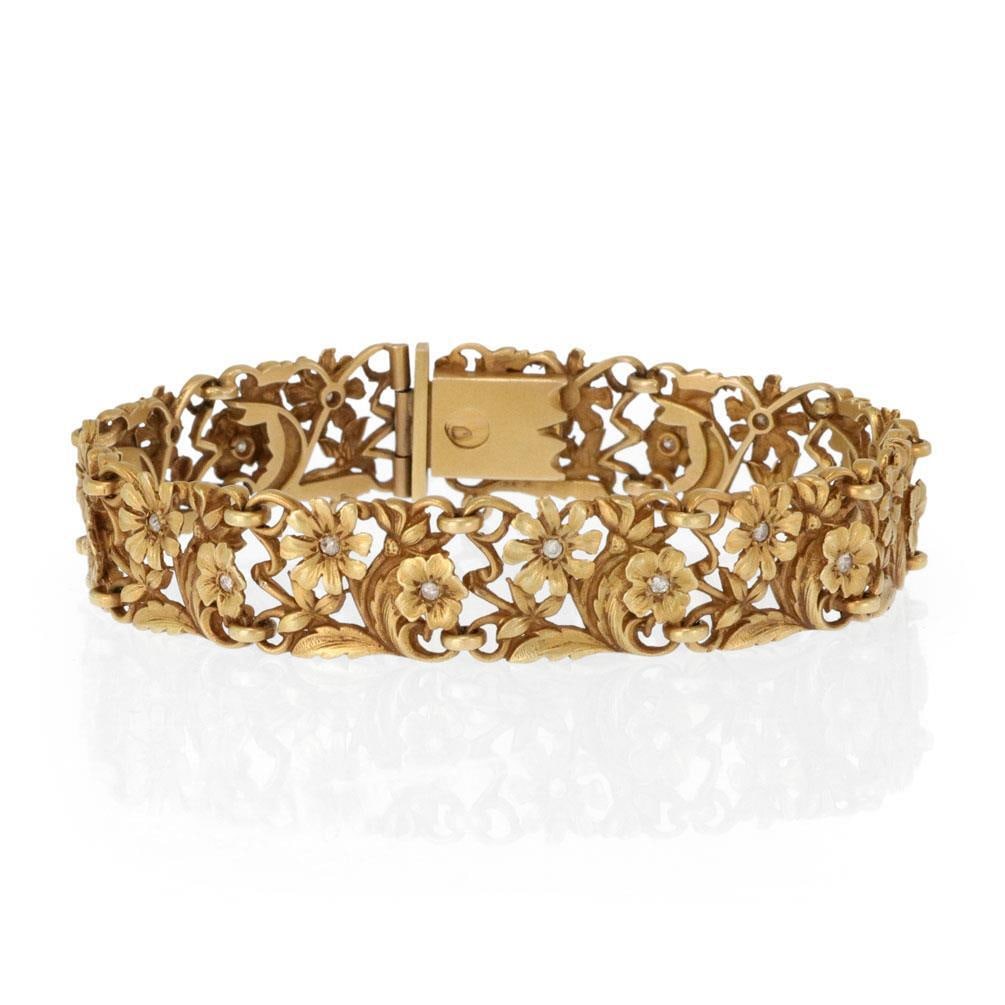 Art Nouveau 18k 17k Gold Flower Bracelet with Diamonds: Art Nouveau 18k 17k Gold Flower Bracelet with Diamonds Experience the charm of nature with this exquisite Art Nouveau bracelet, beautifully designed in a garden style. Crafted from a combination of 18