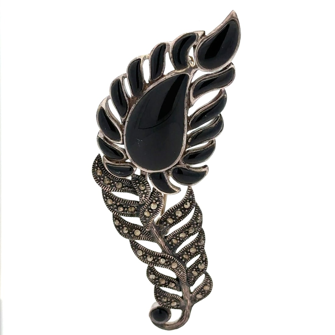 Vintage Large Abstract Feather Brooch Sterling Silver Onyx Marcasite: Vintage Large Abstract Feather Brooch Sterling Silver Onyx Marcasite This exquisite vintage brooch showcases a striking abstract feather design crafted from sterling silver, adorned with natural black