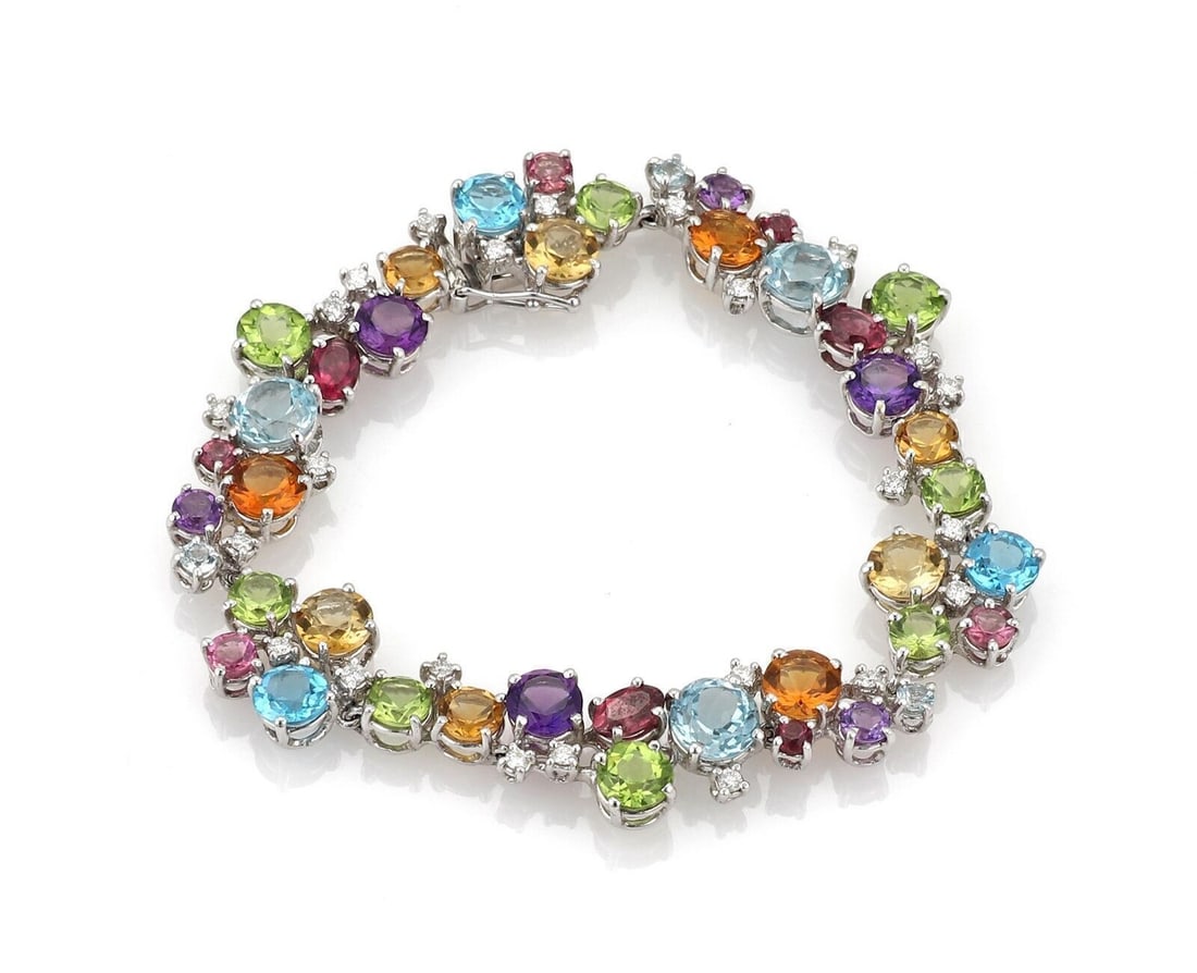 18k White Gold Link Bracelet with Diamonds and Multicolor Gemstones: 18k White Gold Link Bracelet with Diamonds and Multicolor Gemstones This elegant link-style bracelet is crafted from 18k white gold and features a luxurious combination of diamonds and assorted multic