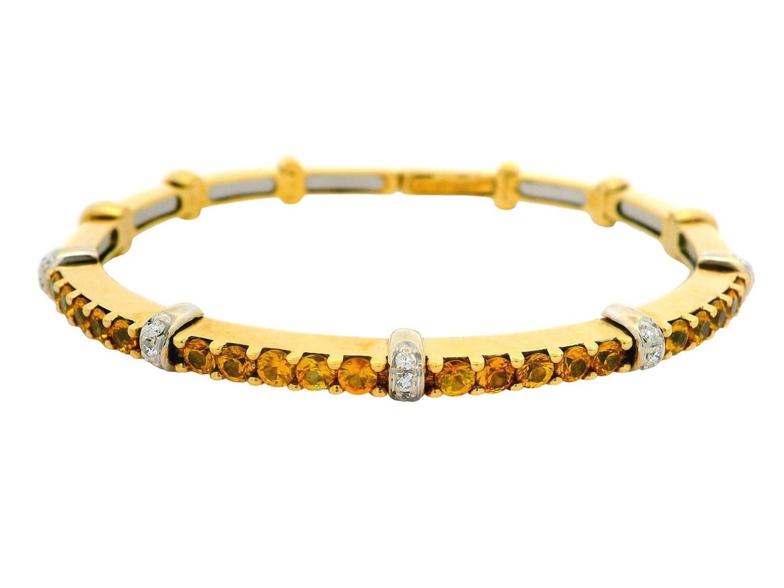 18k Yellow Gold 2.40ctw Diamond & Yellow Topaz Cuff Bracelet: 18k Yellow Gold 2.40ctw Diamond & Yellow Topaz Cuff Bracelet This stunning flexible cuff bracelet is crafted from 18k yellow gold and features a captivating combination of natural gemstones. It showca