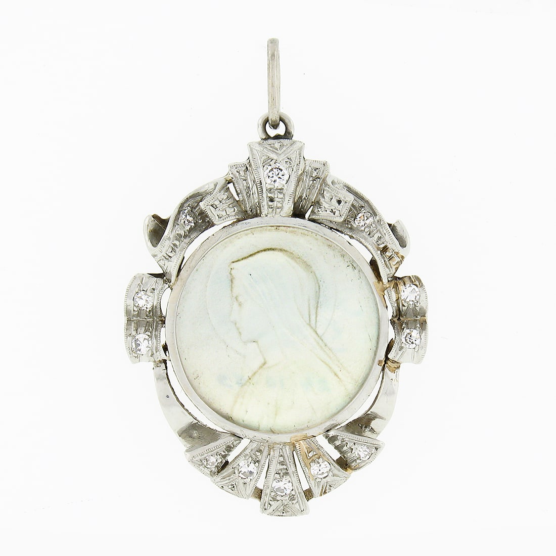 Antique Handmade Platinum Mother of Pearl Virgin Mary Pendant with 0.25ct Diamond Frame: Antique Handmade Platinum Mother of Pearl Virgin Mary Pendant with 0.25ct Diamond Frame This exquisite antique pendant is meticulously crafted from solid 900 platinum, showcasing a beautifully carved