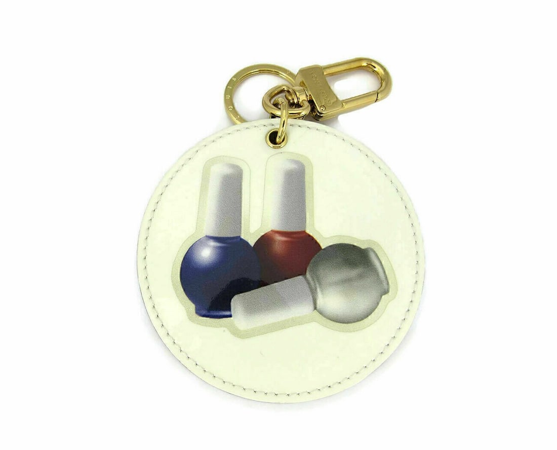 Louis Vuitton Vernis Nail Polish Key Ring White Bag Charm Accessory: Louis Vuitton Vernis Nail Polish Key Ring White Bag Charm Accessory This Louis Vuitton White Vernis Nail Polish Key Holder Bag Charm is a designer accessory crafted in France. Designed as a key ring,