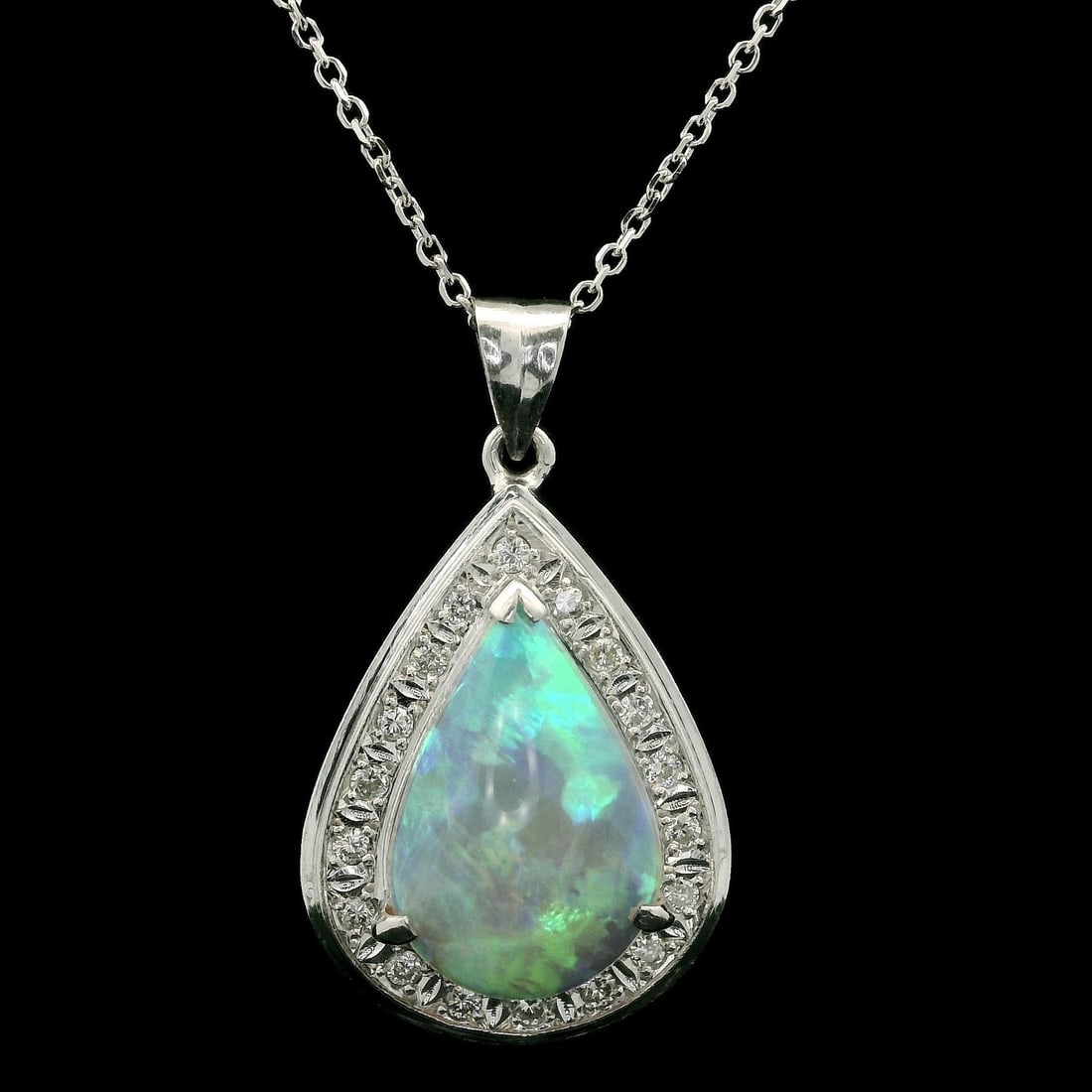 14k White Gold Platinum 3.79ct Opal Diamond Pendant Necklace: 14k White Gold Platinum 3.79ct Opal Diamond Pendant Necklace This exquisite pendant necklace features a stunning natural pear cabochon opal, measuring approximately 15.2x10.5mm and weighing 3.56ct, se
