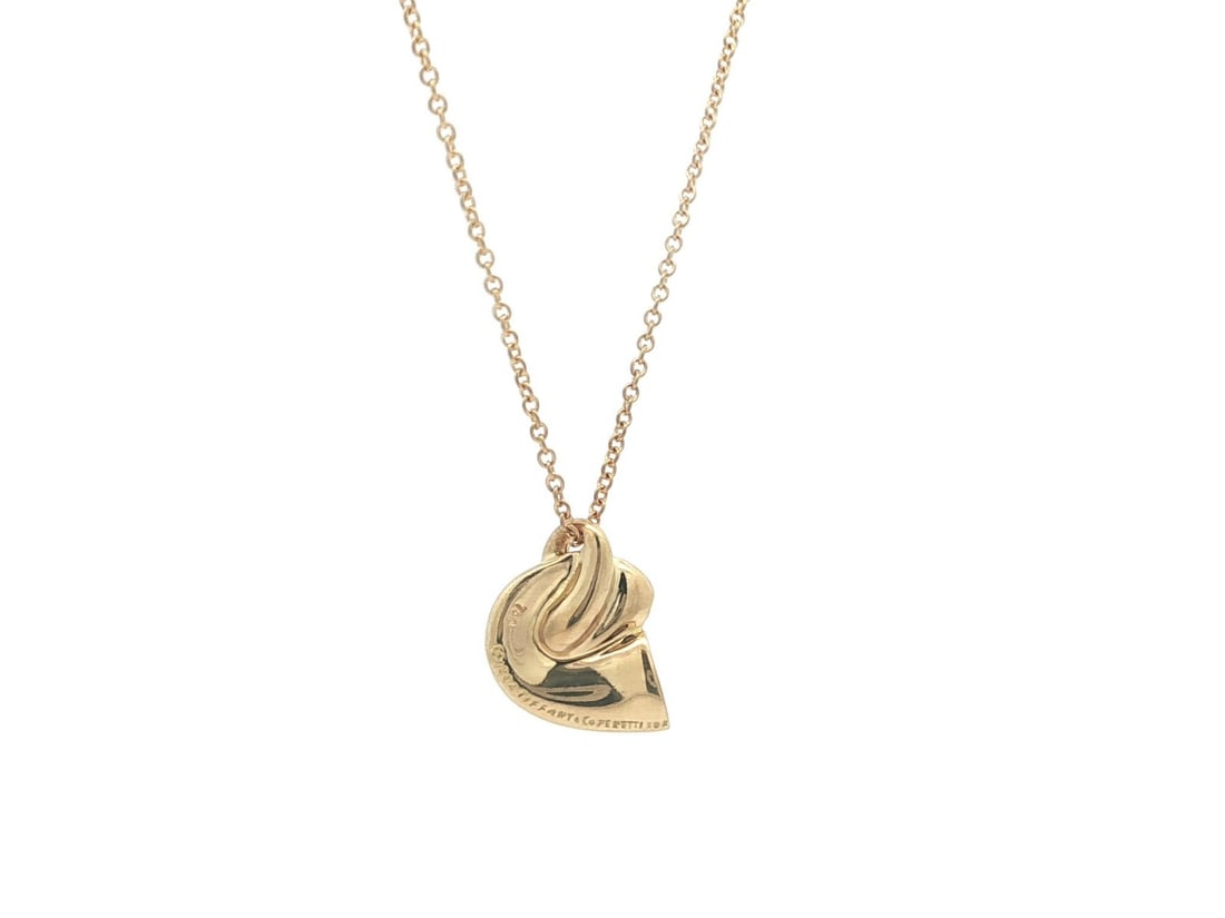 Elsa Peretti Shell Slide Pendant Necklace in 18k Yellow Gold with Original Pouch: Elsa Peretti Shell Slide Pendant Necklace in 18k Yellow Gold with Original Pouch This Tiffany & Co. Elsa Peretti necklace features a shell slide pendant crafted from solid 18k yellow gold, designed in