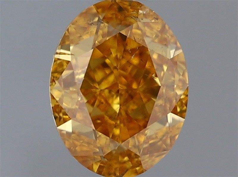Loose Diamond - OVAL 0.61ct Fancy Vivid Yellow Orange SI2: Loose Diamond - OVAL 0.61ct Fancy Vivid Yellow Orange SI2 Source: Natural Shape: OVAL Carats: 0.61 Color: Fancy Vivid Yellow Orange Certification: GIA Video: