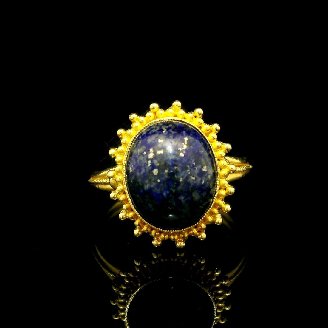 Vintage Handmade 18K Yellow Gold Lapis Lazuli Cocktail Ring: Vintage Handmade 18K Yellow Gold Lapis Lazuli Cocktail Ring This exquisite vintage handmade cocktail ring features a stunning natural lapis lazuli stone. The cabochon is an oval shape, bezel set, disp