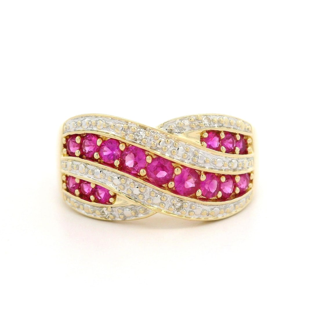 14k Yellow Gold 1.02ctw Ruby Diamond Crossover Band Ring: 14k Yellow Gold 1.02ctw Ruby Diamond Crossover Band Ring This stunning wide crossover style band ring features an exquisite combination of natural genuine rubies and diamonds. Crafted from 14k yellow