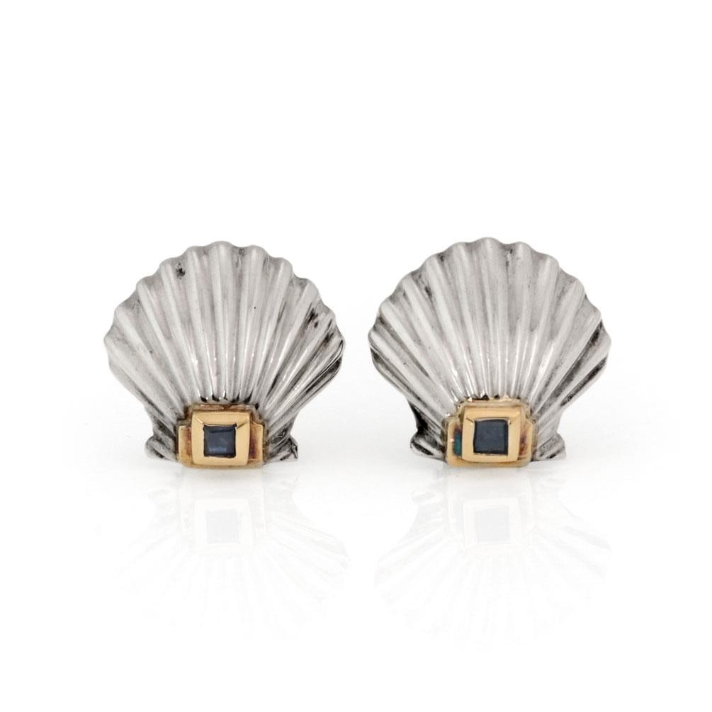 Tiffany & Co. Vintage 14k Gold Silver Sapphire Sea Shell Clip-On Earrings: Tiffany & Co. Vintage 14k Gold Silver Sapphire Sea Shell Clip-On Earrings Discover a stunning pair of vintage clip-on earrings by Tiffany & Co., elegantly designed with 14k yellow gold and silver. Eac