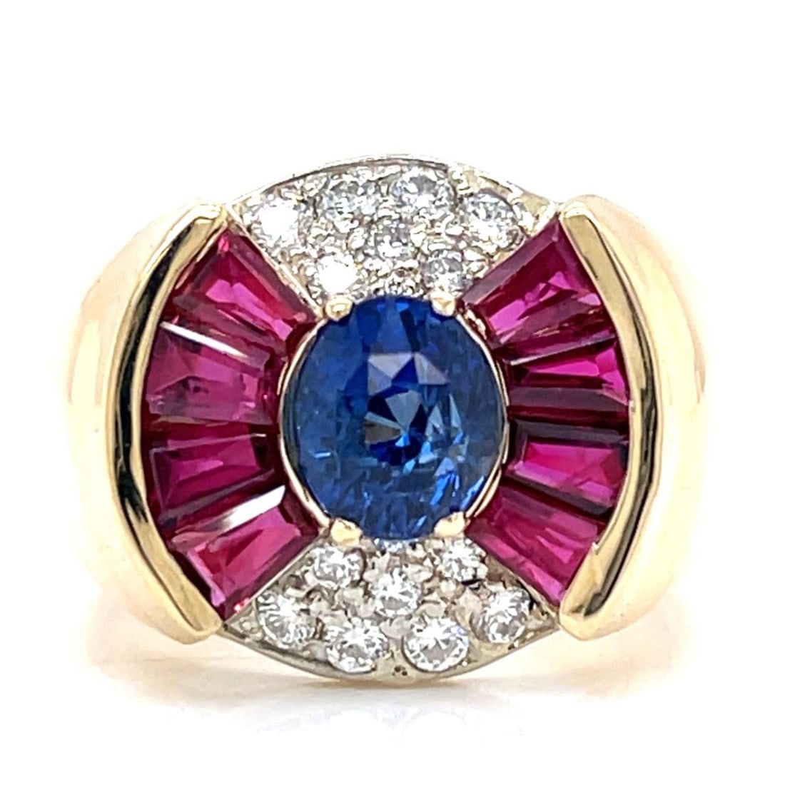 Yellow Gold Ring Featuring Center Sapphire Rubies and Diamonds 18K: Yellow Gold Ring Featuring Center Sapphire Rubies and Diamonds 18K This pre-owned ring is crafted in 18K yellow gold and features a central 2.09 ct sapphire, accented by eight rubies with a total appr