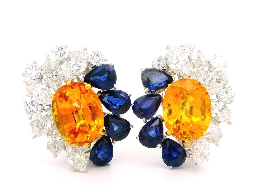Omega Platinum Gold GIA 23.98ctw Orangy Yellow Blue Sapphire Diamond Earrings: Omega Platinum Gold GIA 23.98ctw Orangy Yellow Blue Sapphire Diamond Earrings Elevate your elegance with these stunning earrings featuring a remarkable combination of natural sapphires and diamonds. C