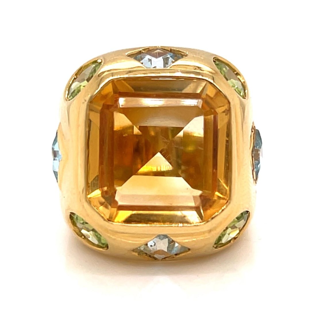 Ring in 18K Yellow Gold with Nine Semi-Precious Gemstones: Ring in 18K Yellow Gold with Nine Semi-Precious Gemstones This 18K yellow gold ring features nine semi-precious stones with a total approximate weight of 20.00 carats. The ring weighs 19.1 grams and i