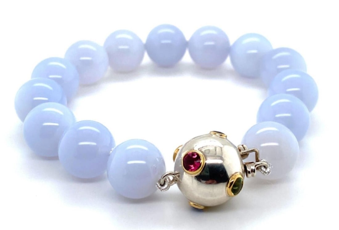 Etoile Beaded Bracelet in 18k Gold Sterling Silver With Chalcedony and Gem Accents: Etoile Beaded Bracelet in 18k Gold Sterling Silver With Chalcedony and Gem Accents This Tiffany & Co. Etoile bracelet features blue chalcedony beads, each measuring 12mm, accented by pink and blue sap