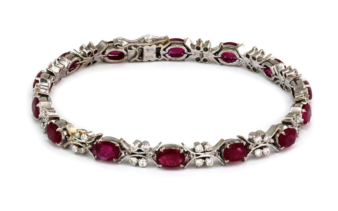 Vintage 18k White Gold Tennis Bracelet with Ruby and Diamond Oval Links: Vintage 18k White Gold Tennis Bracelet with Ruby and Diamond Oval Links This vintage tennis bracelet is crafted from 18k white gold and features an oval link design set with sparkling ruby and diamond