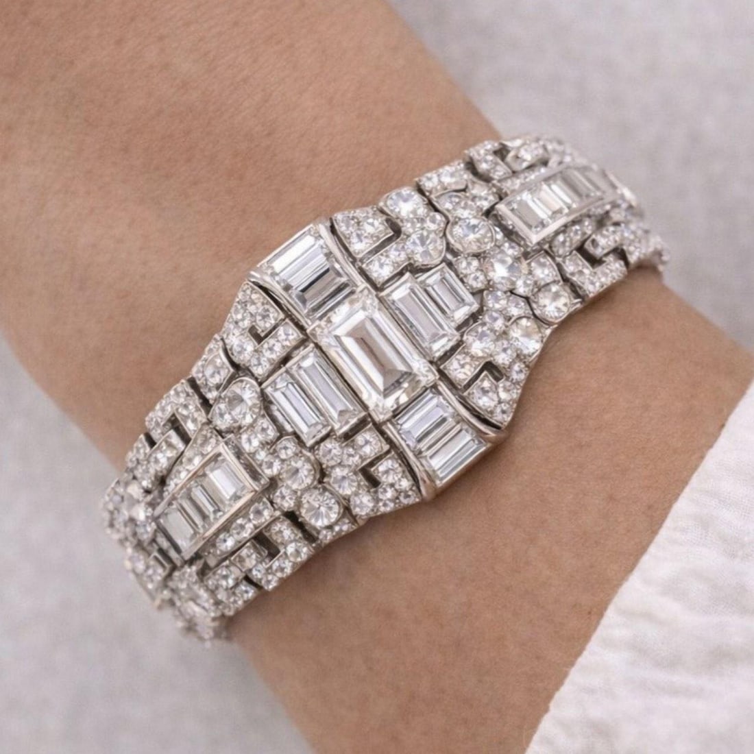 Platinum Art Deco Diamond Bracelet with 38 Carats Total Weight: Platinum Art Deco Diamond Bracelet with 38 Carats Total Weight This Art Deco bracelet is crafted from platinum and features a total diamond weight of approximately 38.00 carats. The centerpiece is an