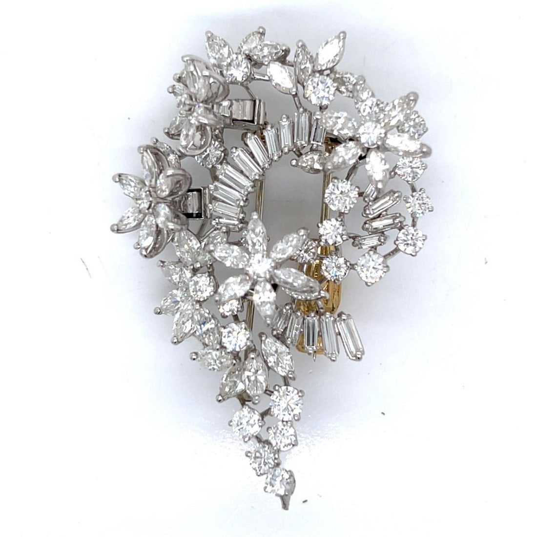 1960s Platinum Diamond En Tremblant Brooch 15 Ct 48 Marquise 25 Round 19 Baguette: 1960s Platinum Diamond En Tremblant Brooch 15 Ct 48 Marquise 25 Round 19 Baguette This exquisite 1960's Platinum En Tremblant Brooch features a stunning total diamond weight of 15.00 Ct. Crafted from