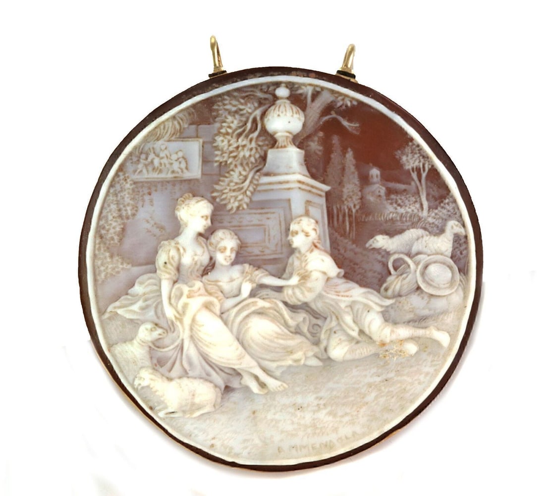 18k Yellow Gold Cameo Pendant with Large Carved Shell Design: 18k Yellow Gold Cameo Pendant with Large Carved Shell Design This large carved shell cameo pendant is crafted from 18k yellow gold and features a finely detailed cameo design. The pendant is made with