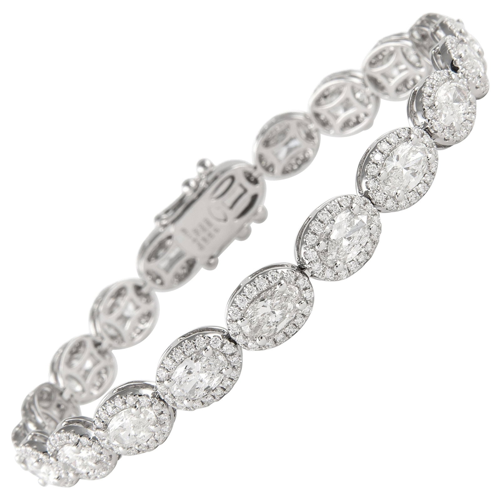 9.89ct Oval Diamond Tennis Bracelet 18k White Gold: 9.89ct Oval Diamond Tennis Bracelet 18k White Gold This elegant 9.89ct Oval Diamond Tennis Bracelet features a stunning halo design crafted in 18k white gold. The bracelet showcases 20 oval brilliant