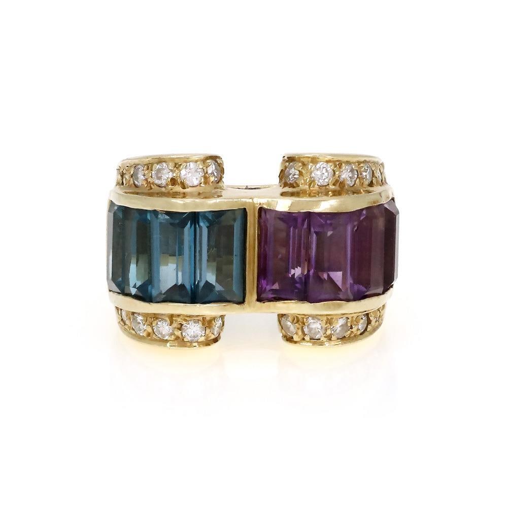 1980s Vintage 14k Yellow Gold Amethyst Blue Topaz Diamond Ring: 1980s Vintage 14k Yellow Gold Amethyst Blue Topaz Diamond Ring This exquisite vintage ring from the 1980s is crafted from 14k yellow gold, showcasing a unique curved ribbon design. One side features s