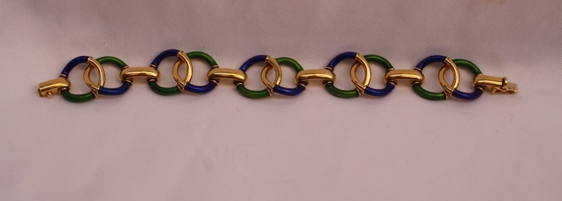 Vintage 1950s French 18K Gold Green Enameled Charm Bracelet: Vintage 1950s French 18K Gold Green Enameled Charm Bracelet Discover the elegance of this exquisite 1950's French bracelet crafted from 18k yellow gold. The bracelet features beautiful green enamel de