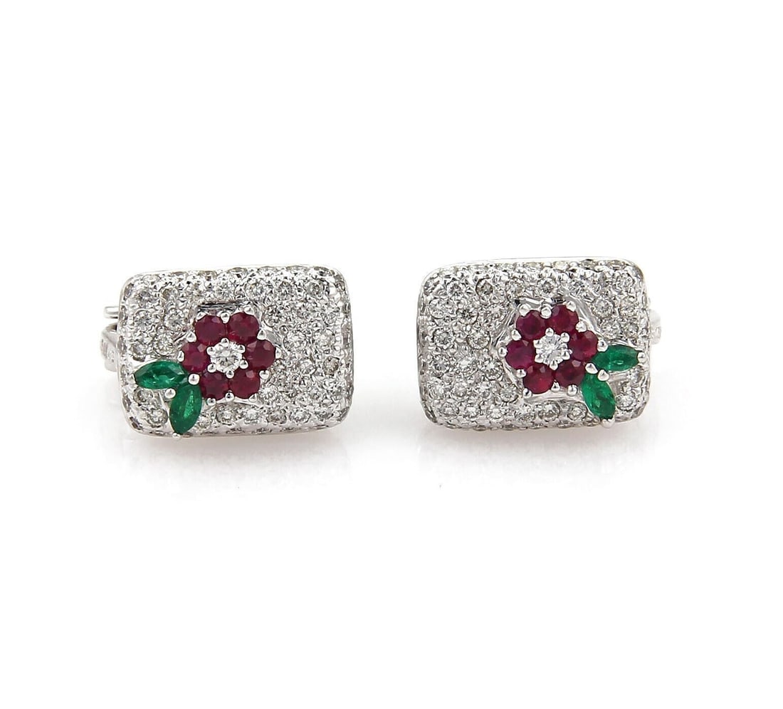 Floral Stud Earrings in 18k White Gold with Diamonds Emeralds and Sapphires: Floral Stud Earrings in 18k White Gold with Diamonds Emeralds and Sapphires These vintage floral stud earrings are crafted in 18k white gold and feature a sophisticated design set with approximately 1