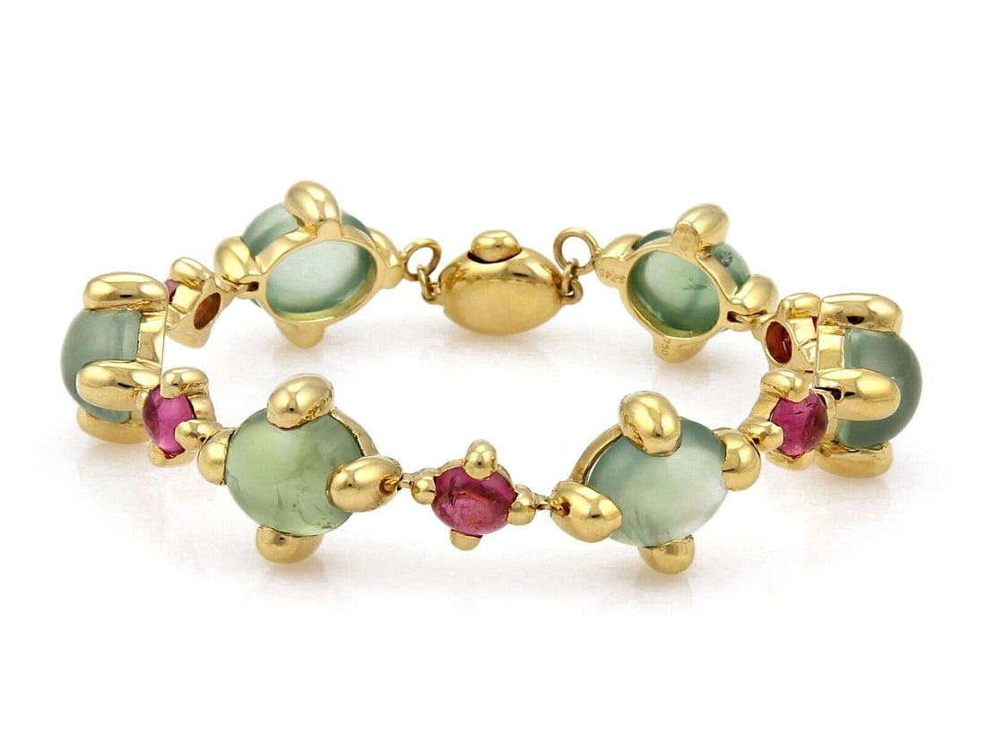 18k Yellow Gold Bracelet With Green and Pink Tourmaline Oval Links: 18k Yellow Gold Bracelet With Green and Pink Tourmaline Oval Links This authentic link bracelet is crafted from solid 18k yellow gold and features a bold oval link design adorned with vibrant green an