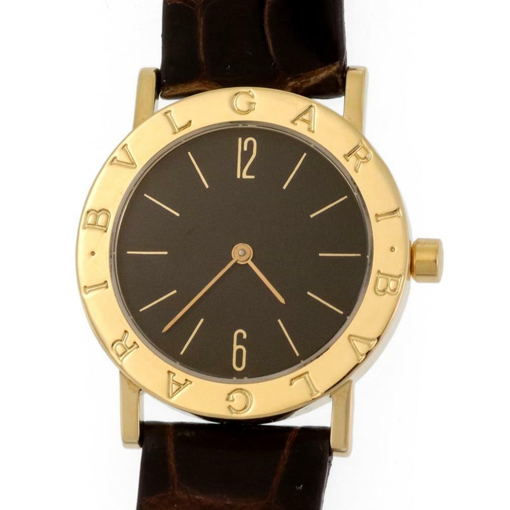 Bvlgari 18k Yellow Gold Men's Watch with Alligator Leather Band: Bvlgari 18k Yellow Gold Men's Watch with Alligator Leather Band This exquisite Bvlgari men's wristwatch features a case and buckle made of 18k yellow gold with a polished finish, showcasing the brand'
