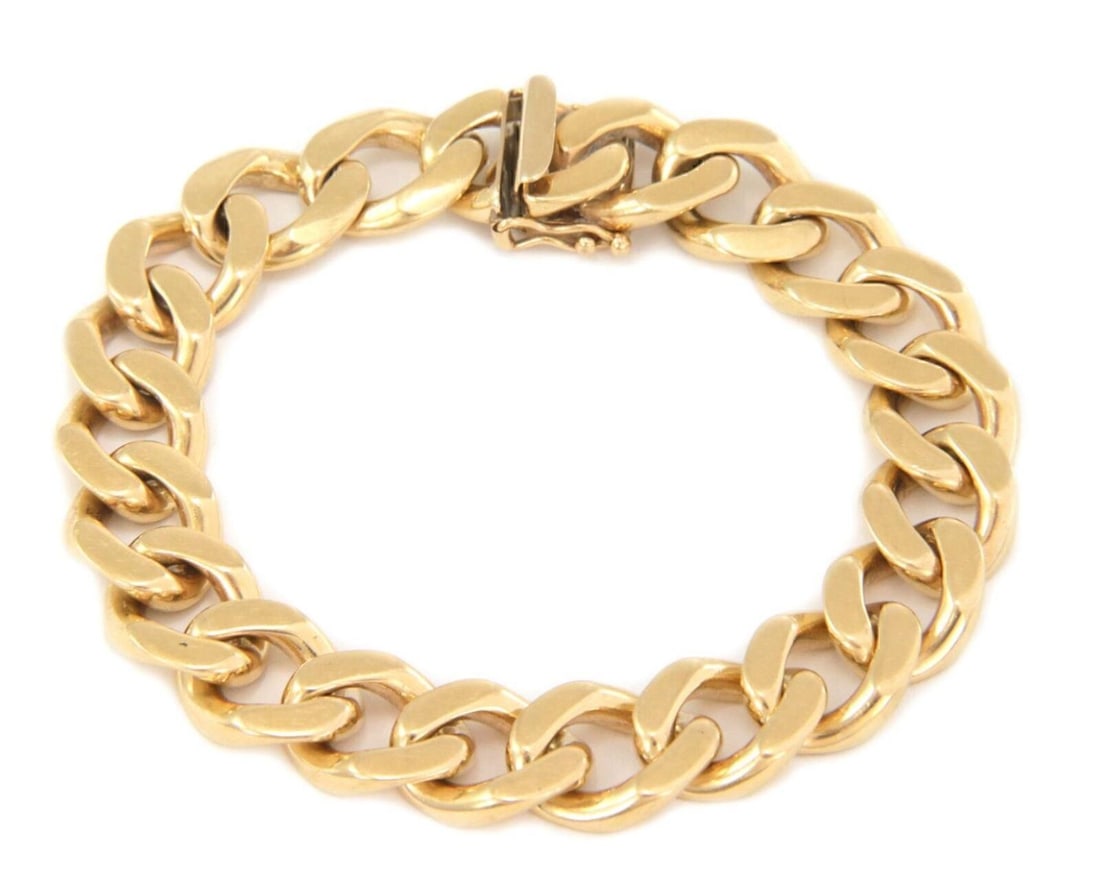 Cuban Link Bracelet in Solid 14k Yellow Gold 8.5 Inch Length: Cuban Link Bracelet in Solid 14k Yellow Gold 8.5 Inch Length This Cuban link chain bracelet is crafted from solid 14k yellow gold, offering a bold and luxurious look. It features a substantial weight,