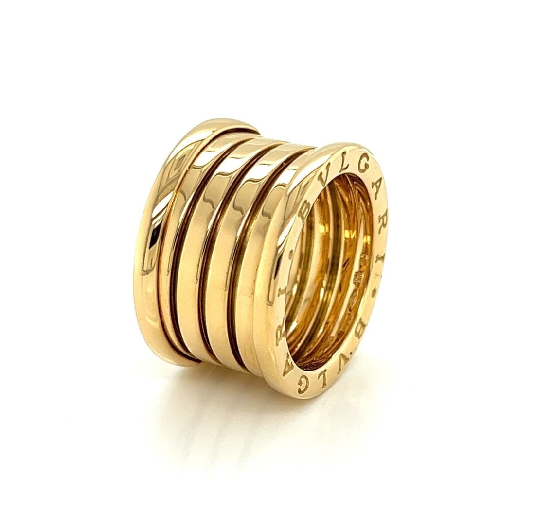 Bvlgari B.zero1 Five-Band Anniversary Ring 18k Yellow Gold Size 5.5: Bvlgari B.zero1 Five-Band Anniversary Ring 18k Yellow Gold Size 5.5 This authentic Bvlgari B.zero1 Anniversary Five-Band Ring is crafted in 18k yellow gold and features a distinctive five-band design