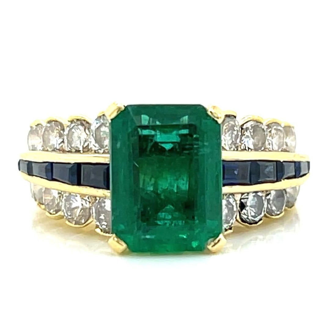 Stunning 18K Yellow Gold Emerald Sapphire Diamond Ring 3.61 Ct Center: Stunning 18K Yellow Gold Emerald Sapphire Diamond Ring 3.61 Ct Center This stunning 18K yellow gold ring features a vibrant 3.61 Ct. emerald at its center, surrounded by 20 sparkling diamonds totaling