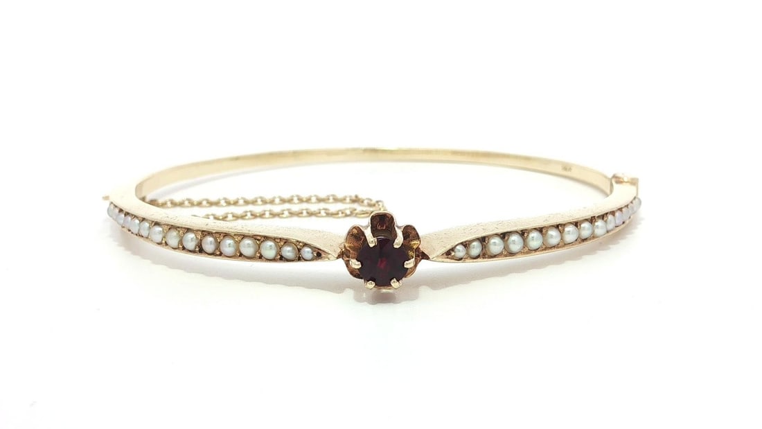 Vintage Victorian Revival 13-14K Yellow Gold Garnet Seed Pearl Bangle Bracelet: Vintage Victorian Revival 13-14K Yellow Gold Garnet Seed Pearl Bangle Bracelet This exquisite Vintage Victorian Revival Open Bangle Bracelet features a stunning combination of natural garnet and seed