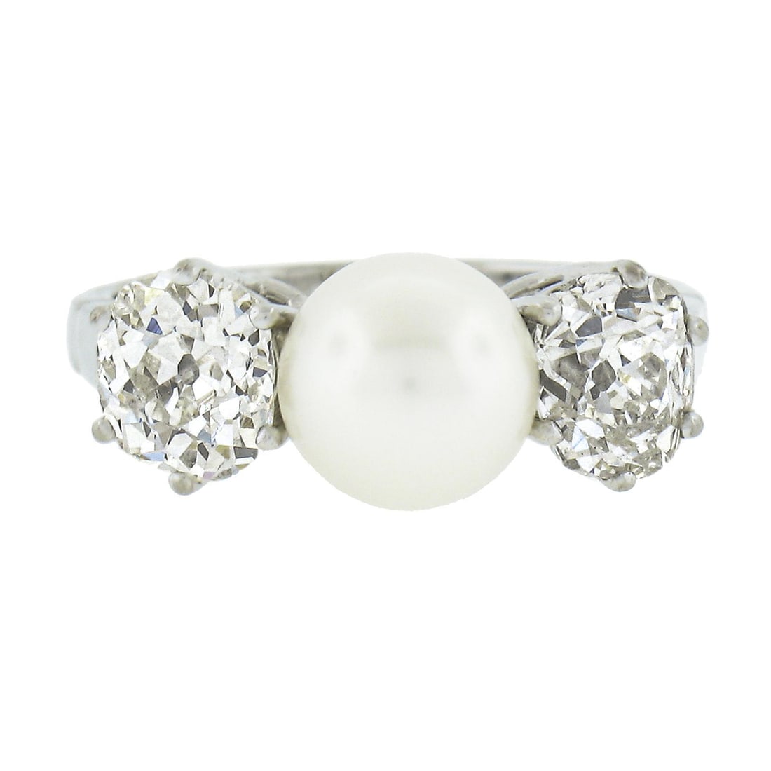 14k White Gold Pearl 1.40ct Old Mine Cut Diamond Ring: 14k White Gold Pearl 1.40ct Old Mine Cut Diamond Ring This exquisite ring features a stunning 6.9mm round genuine cultured pearl, beautifully set in solid 14k white gold. The centerpiece is complement