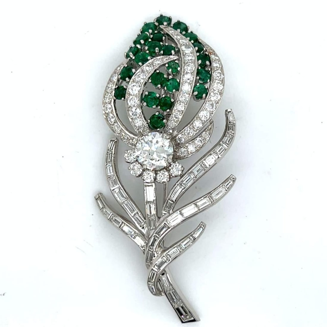 Stunning 1950's Platinum Flower Brooch with Emeralds and Diamonds: Stunning 1950's Platinum Flower Brooch with Emeralds and Diamonds This exquisite 1950's Platinum Emerald & Diamond Flower Brooch showcases timeless elegance and intricate craftsmanship. Weighing 21.6