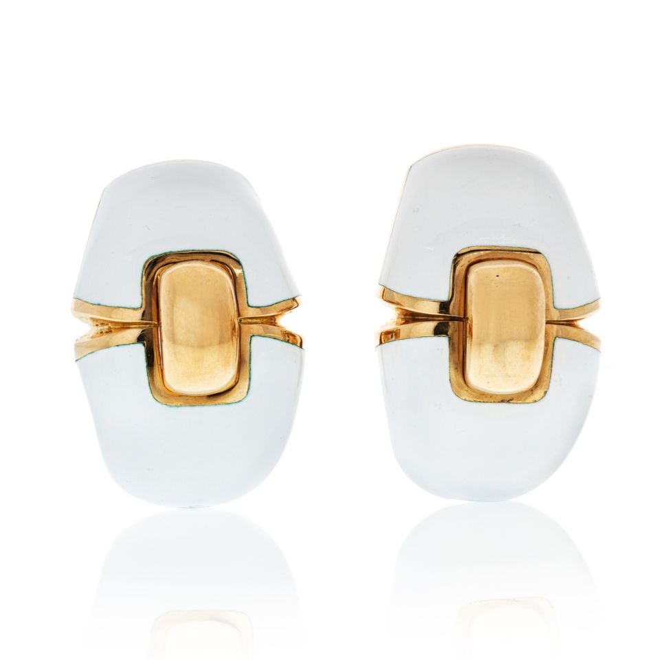 David Webb Clip-On Earrings Platinum 18K Yellow Gold White Enamel: David Webb Clip-On Earrings Platinum 18K Yellow Gold White Enamel These exquisite David Webb clip-on earrings combine a luxurious design with fine materials. Crafted from a blend of platinum and 18K y