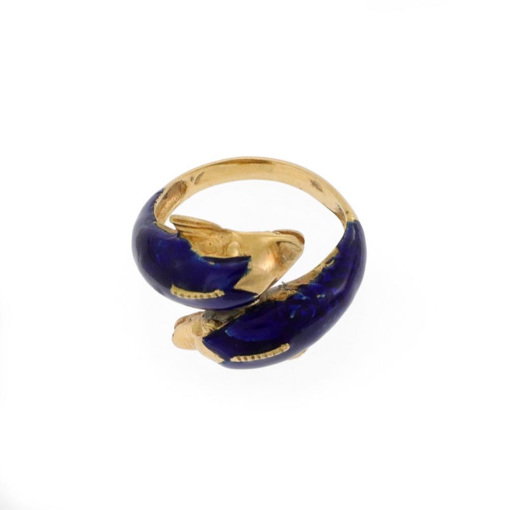 Vintage Greece 18k Gold Enamel Dolphins Bypass Ring SMS750: Vintage Greece 18k Gold Enamel Dolphins Bypass Ring SMS750 This charming bypass ring showcases a delightful design featuring two dolphins crafted from 18k yellow gold. Each dolphin is beautifully acce