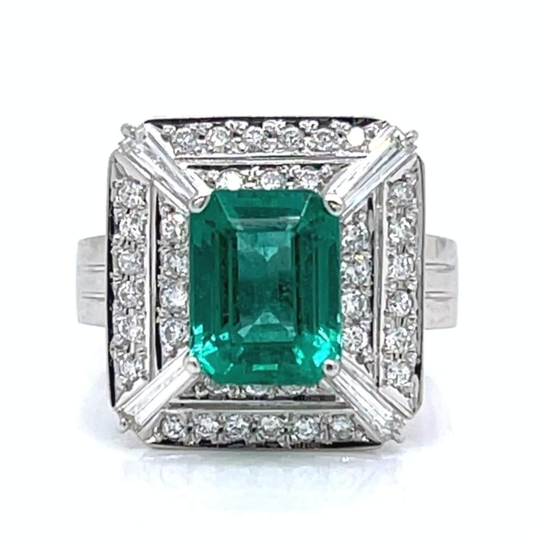 Elegant Platinum 2.46 Ct Emerald Diamond Ring with 42 Diamonds: Elegant Platinum 2.46 Ct Emerald Diamond Ring with 42 Diamonds This exquisite Platinum ring features a stunning 2.46 Ct. Emerald at its center, surrounded by 42 sparkling diamonds weighing approximate