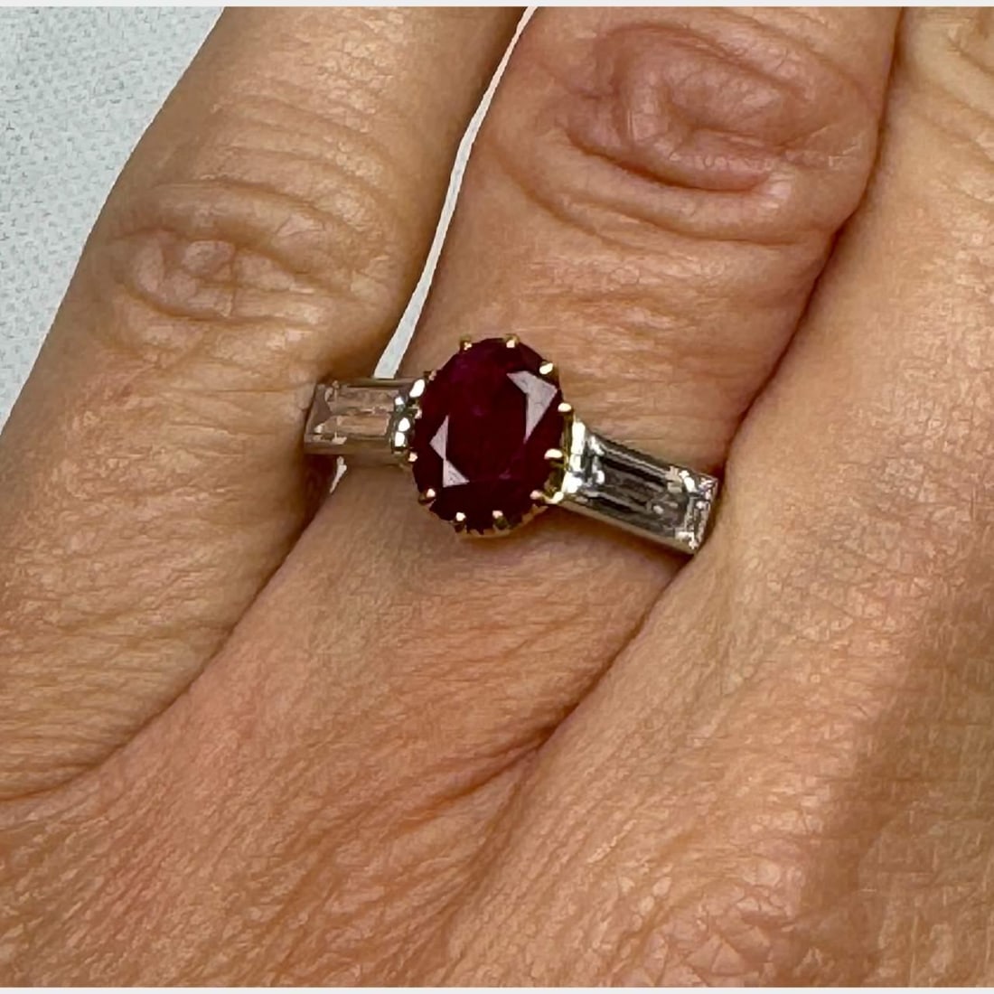 Elegant Ruby 1.30 Ct Diamond Ring Platinum 18K Gold: Elegant Ruby 1.30 Ct Diamond Ring Platinum 18K Gold This exquisite Ruby & Diamond Ring features a stunning ruby weighing approximately 1.30 carats, complemented by two diamonds totaling approximately