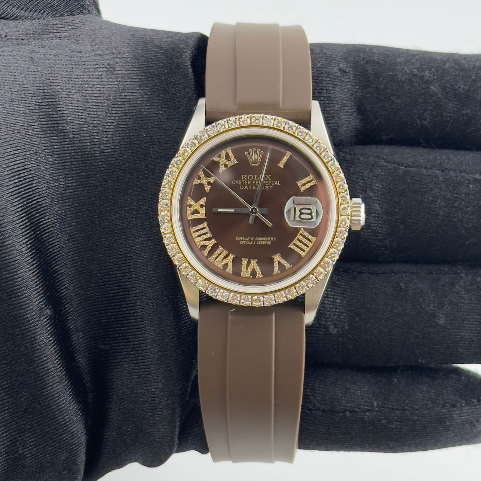 Datejust Ref 1601 Mens Watch Aftermarket Brown Roman Dial Diamond Bezel Rubber Strap: Datejust Ref 1601 Mens Watch Aftermarket Brown Roman Dial Diamond Bezel Rubber Strap This Rolex Datejust features an aftermarket brown Roman numeral dial, a diamond bezel, and an aftermarket rubber br
