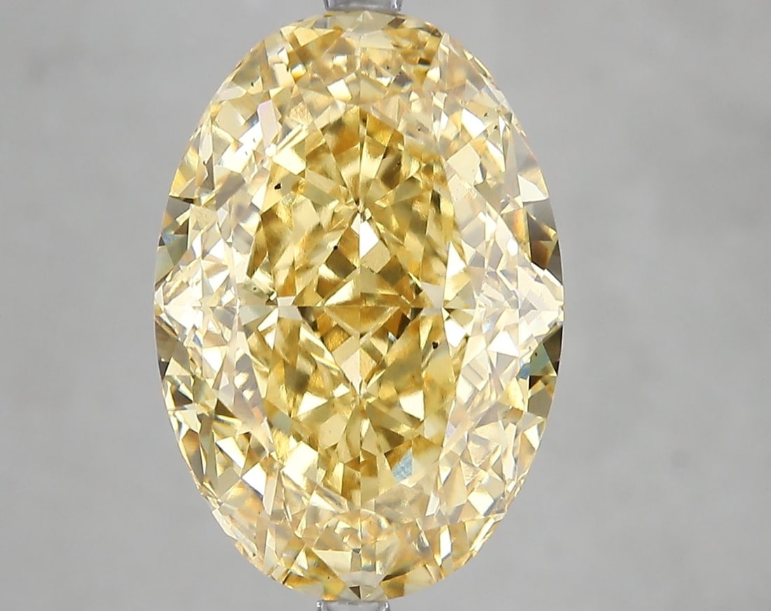 Loose Diamond - OVAL 10.11ct Fancy Vivid Yellow VS2: Loose Diamond - OVAL 10.11ct Fancy Vivid Yellow VS2 Source: This is a real non-mined Diamond that has been grown in a lab Shape: OVAL Carats: 10.11 Color: Fancy Vivid Yellow Certification: IGI Video:
