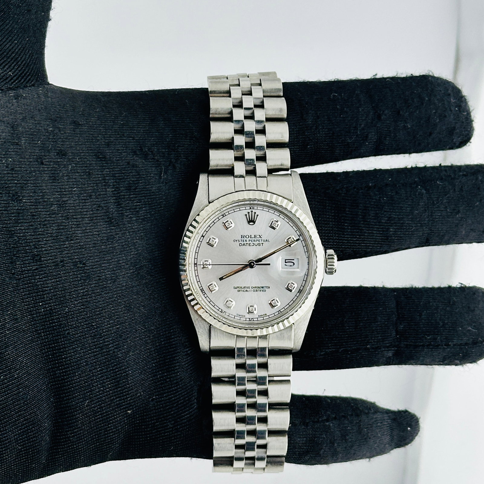 Aftermarket Diamond Dial Rolex Datejust Ref 16014 with Aftermarket Jubilee Bracelet: Aftermarket Diamond Dial Rolex Datejust Ref 16014 with Aftermarket Jubilee Bracelet This men's Rolex Datejust features an aftermarket purple Roman diamond dial, paired with an aftermarket Jubilee brac
