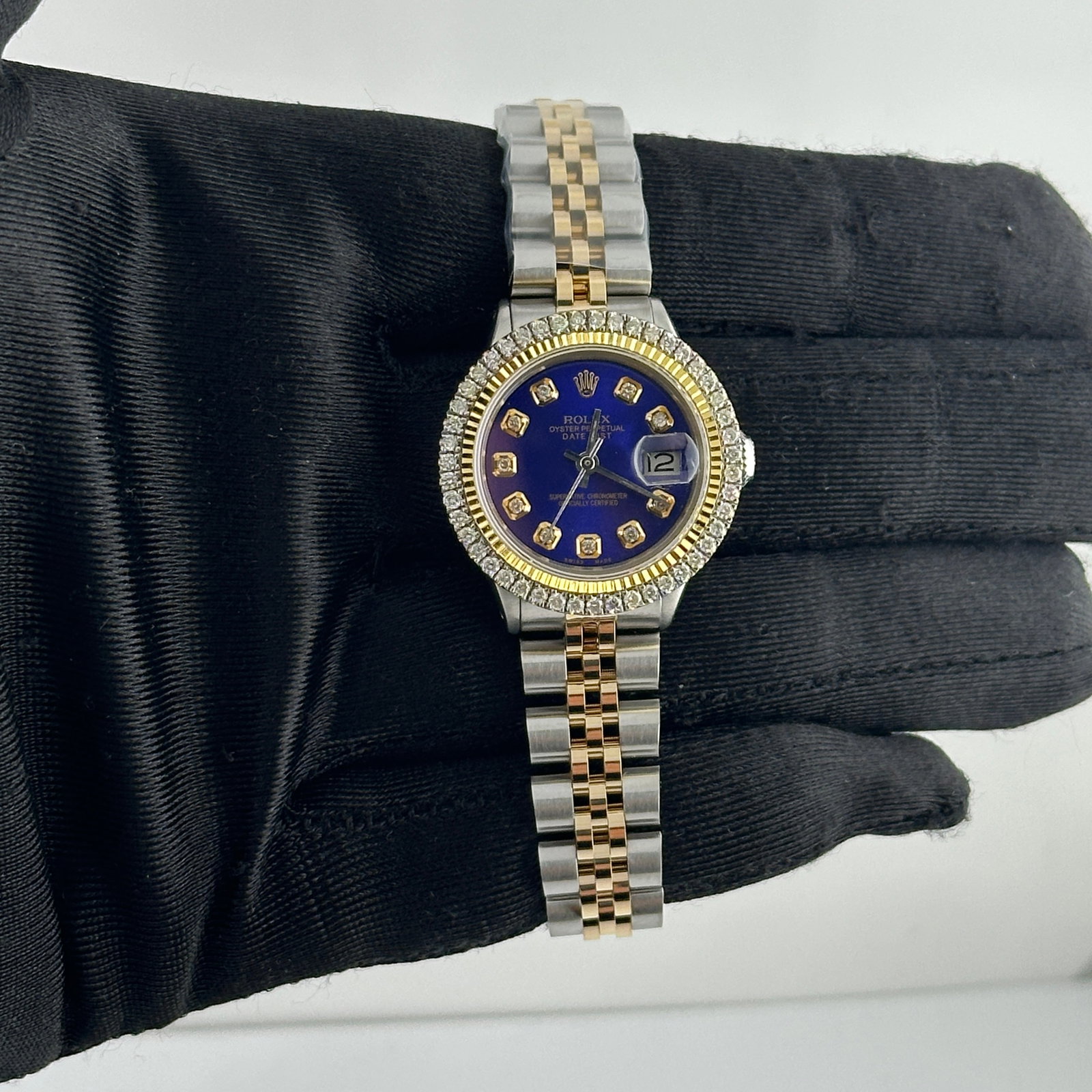 Ladies Datejust Ref 6517 Blue Diamond Dial Aftermarket Jubilee Bracelet: Ladies Datejust Ref 6517 Blue Diamond Dial Aftermarket Jubilee Bracelet This ladies Rolex Datejust features an aftermarket blue diamond dial, an aftermarket Jubilee bracelet, and a prong-set diamond-p