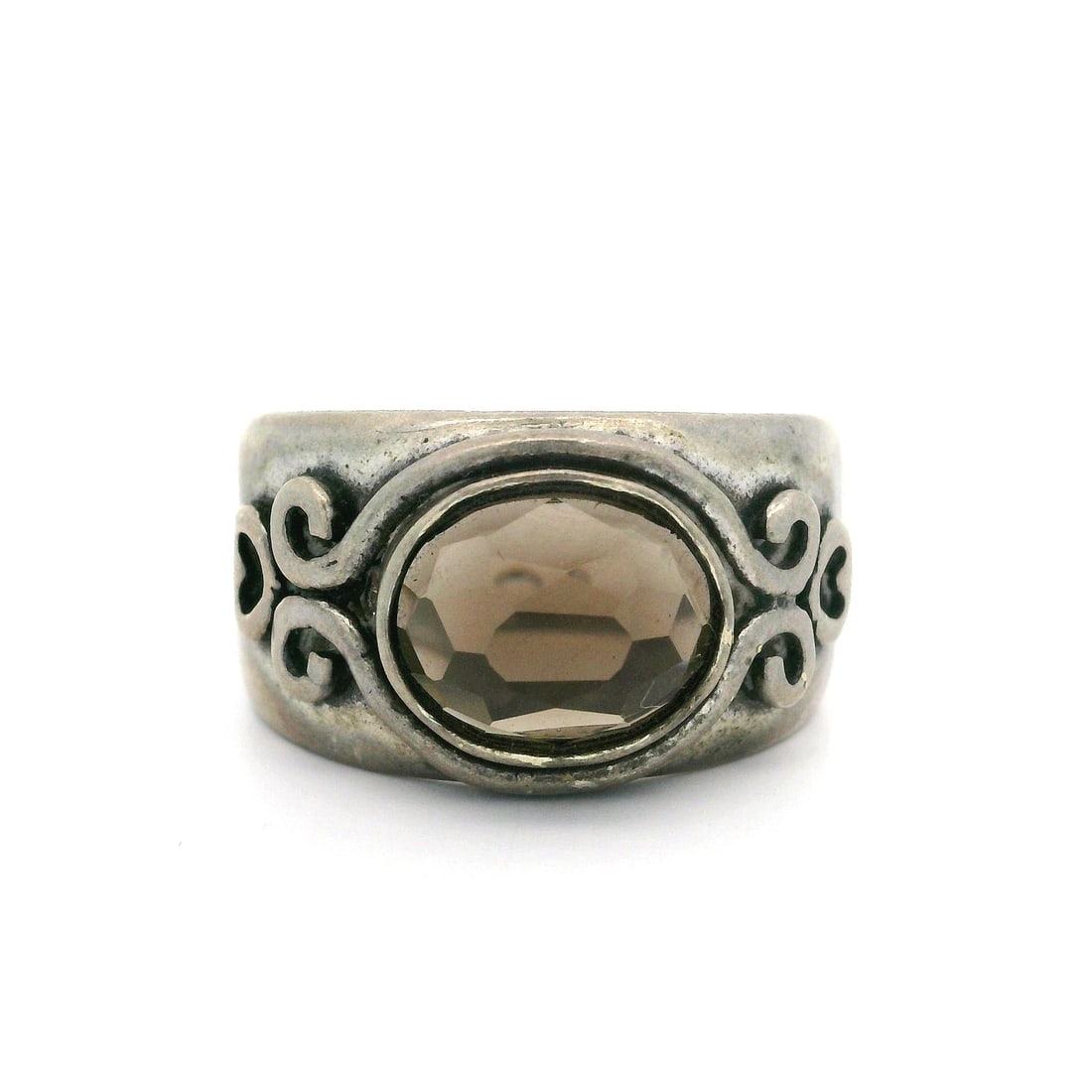 Vintage Sterling Silver Heart Ring with Smokey Quartz: Vintage Sterling Silver Heart Ring with Smokey Quartz This exquisite vintage ring showcases a stunning heart-shaped smokey quartz, beautifully set in a sterling silver bezel. The intricate scroll work