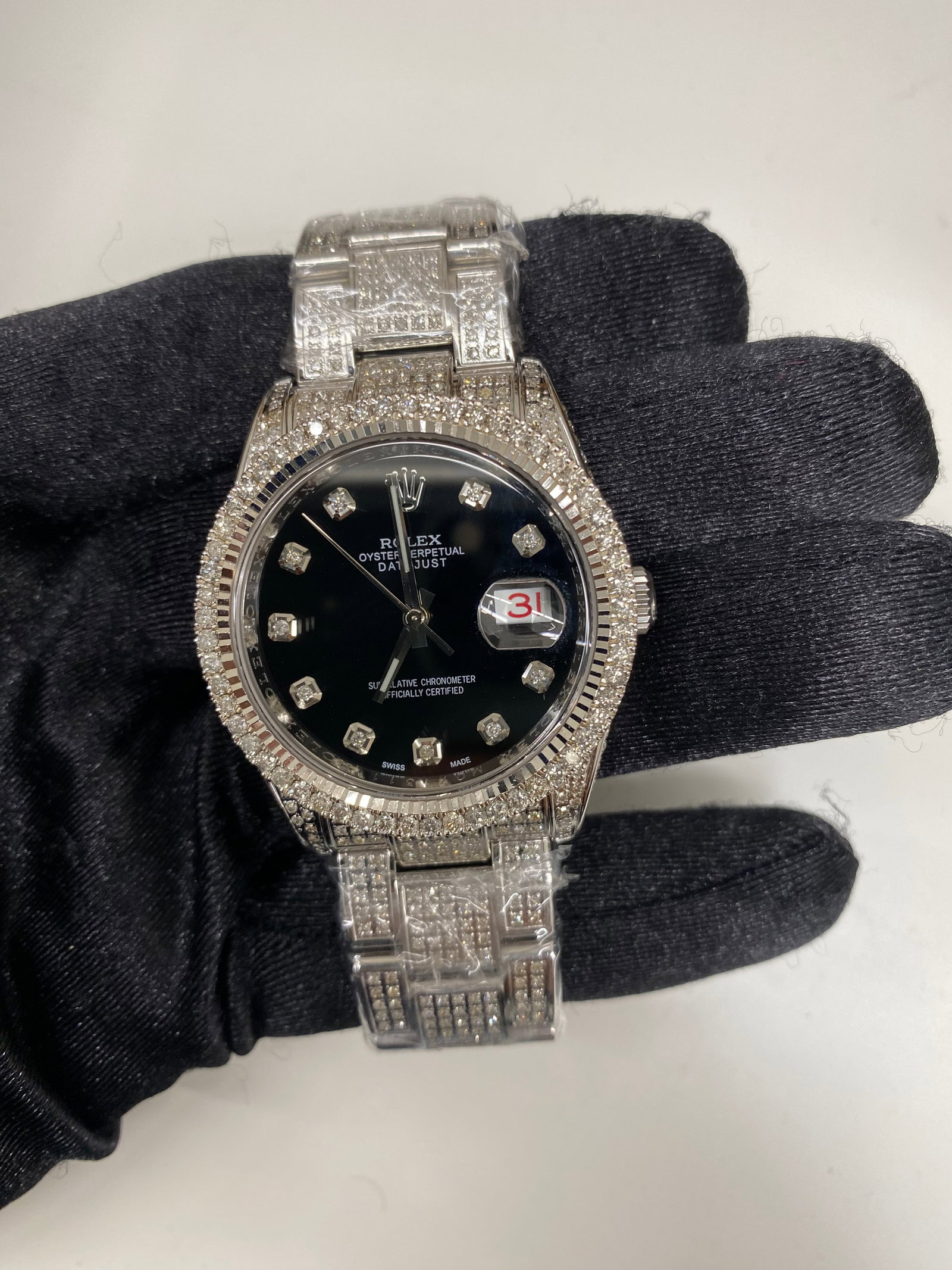 Rolex Datejust 116200 Aftermarket Black Dial Oyster Bracelet 2009 with Card: Rolex Datejust 116200 Aftermarket Black Dial Oyster Bracelet 2009 with Card This Rolex Datejust features an Aftermarket black dial and a diamond bezel, paired with an Oyster bracelet. The watch is a m