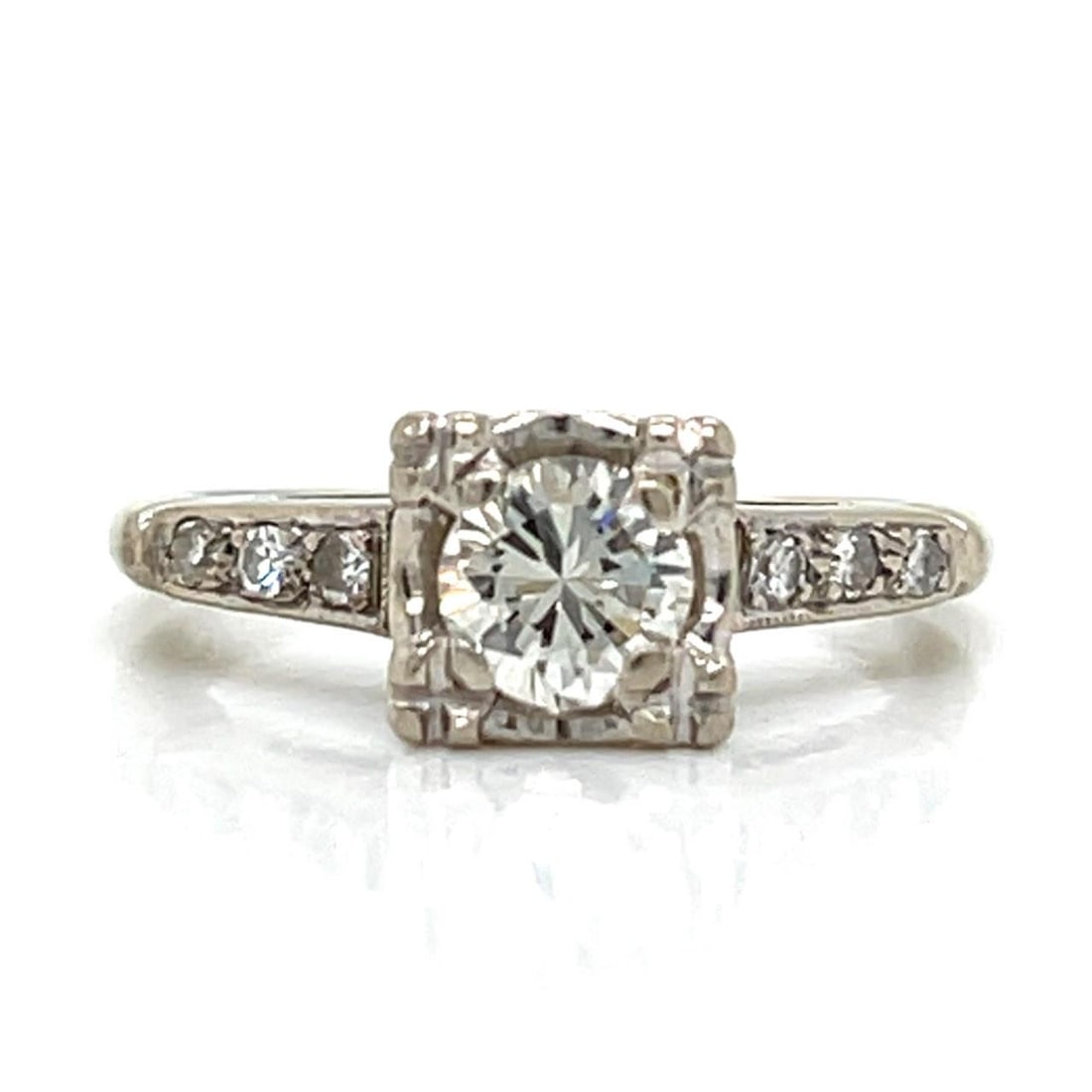 Vintage 14K White Gold Engagement Ring With 0.50 Ct Diamond Center: Vintage 14K White Gold Engagement Ring With 0.50 Ct Diamond Center This 1960s engagement ring is crafted from 14K white gold and features a central diamond of approximately 0.50 carats with J color an