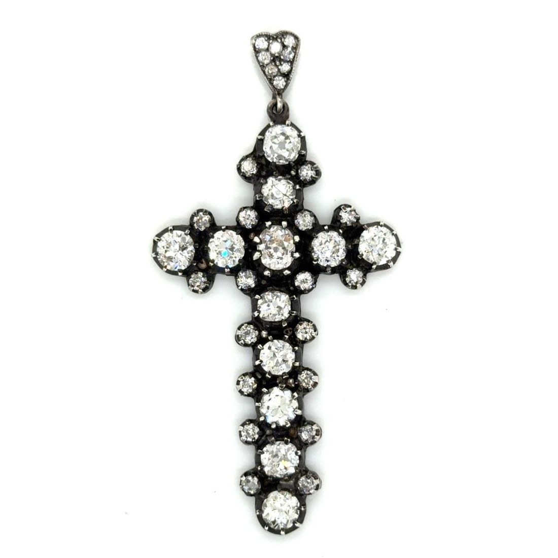 Cross Pendant in 18K Gold and Silver with Old Mine Diamonds 9.00 Carat: Cross Pendant in 18K Gold and Silver with Old Mine Diamonds 9.00 Carat This pendant features a cross design crafted with a silver top and 18K gold. The piece is set with 12 old mine cut diamonds total
