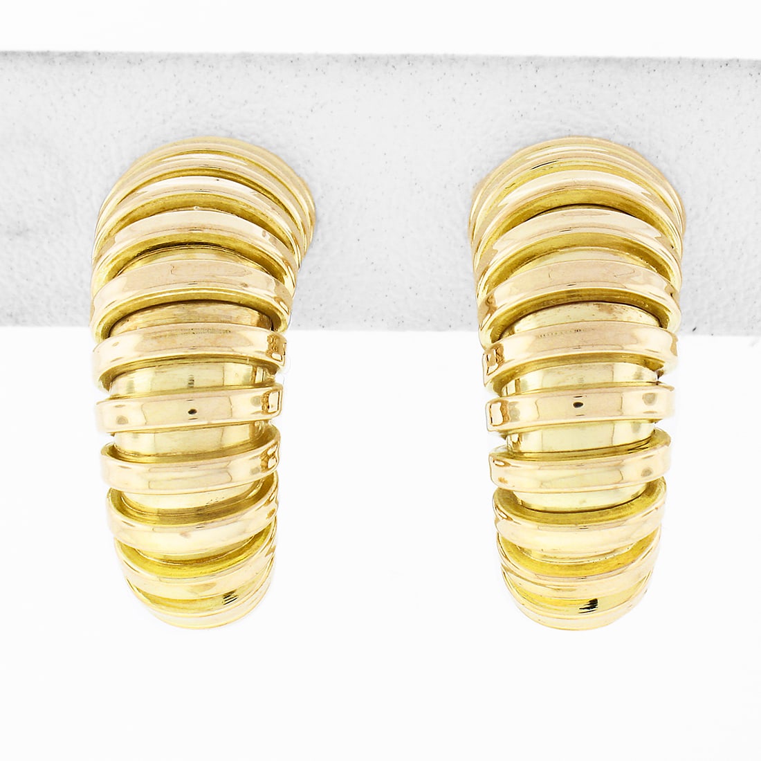 FRED 14K Yellow Gold Graduated Grooved Clip-On Hoop Earrings: FRED 14K Yellow Gold Graduated Grooved Clip-On Hoop Earrings Elevate your elegance with these exquisite FRED 14K Yellow Gold Graduated Grooved Polished Hoop Huggie Clip-On Earrings. Crafted from solid
