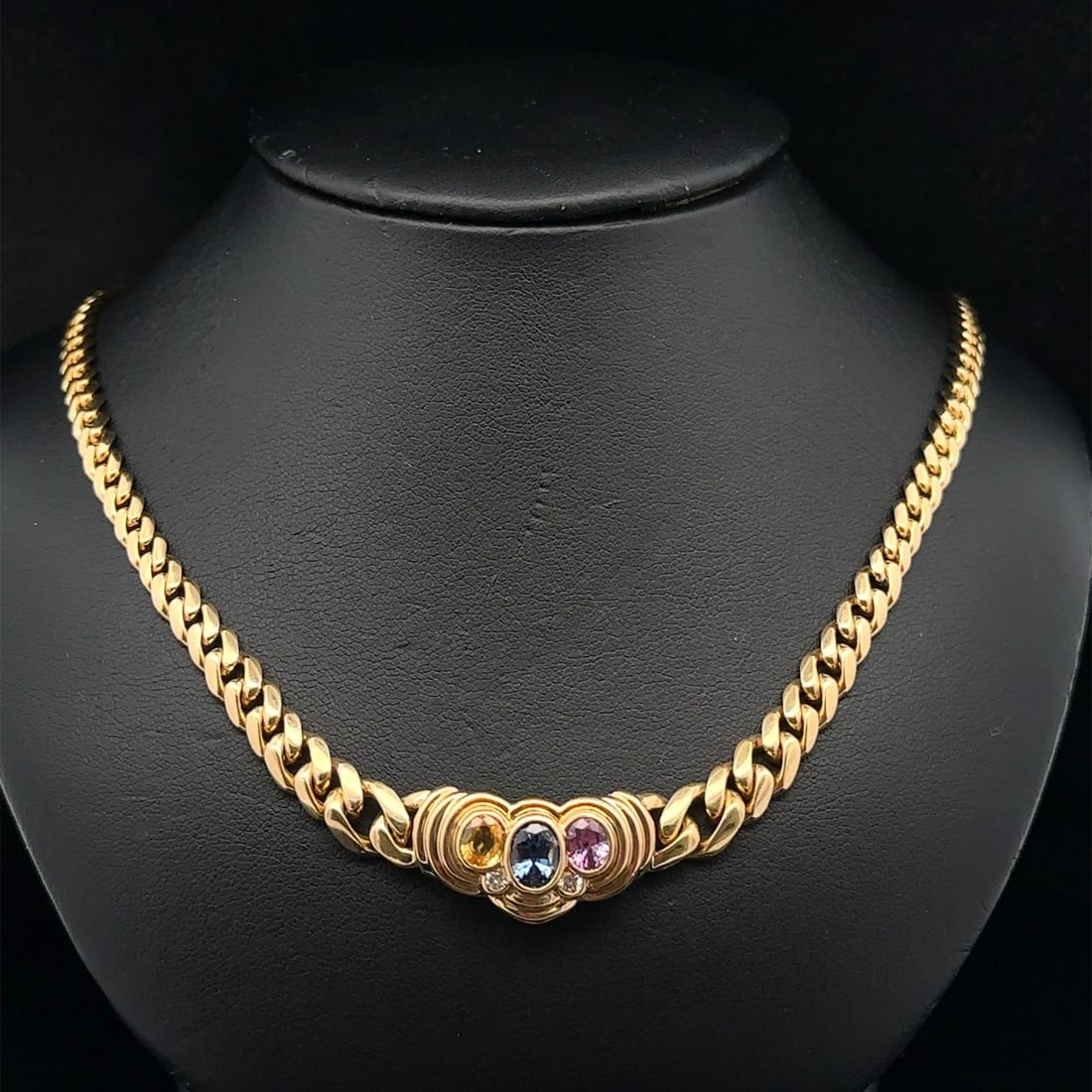 18k Yellow Gold Chain Necklace With Pink Blue Yellow Sapphires And Diamonds French: 18k Yellow Gold Chain Necklace With Pink Blue Yellow Sapphires And Diamonds French This elegant French necklace features three natural oval sapphires in blue, pink, and yellow, bezel set in solid 18k