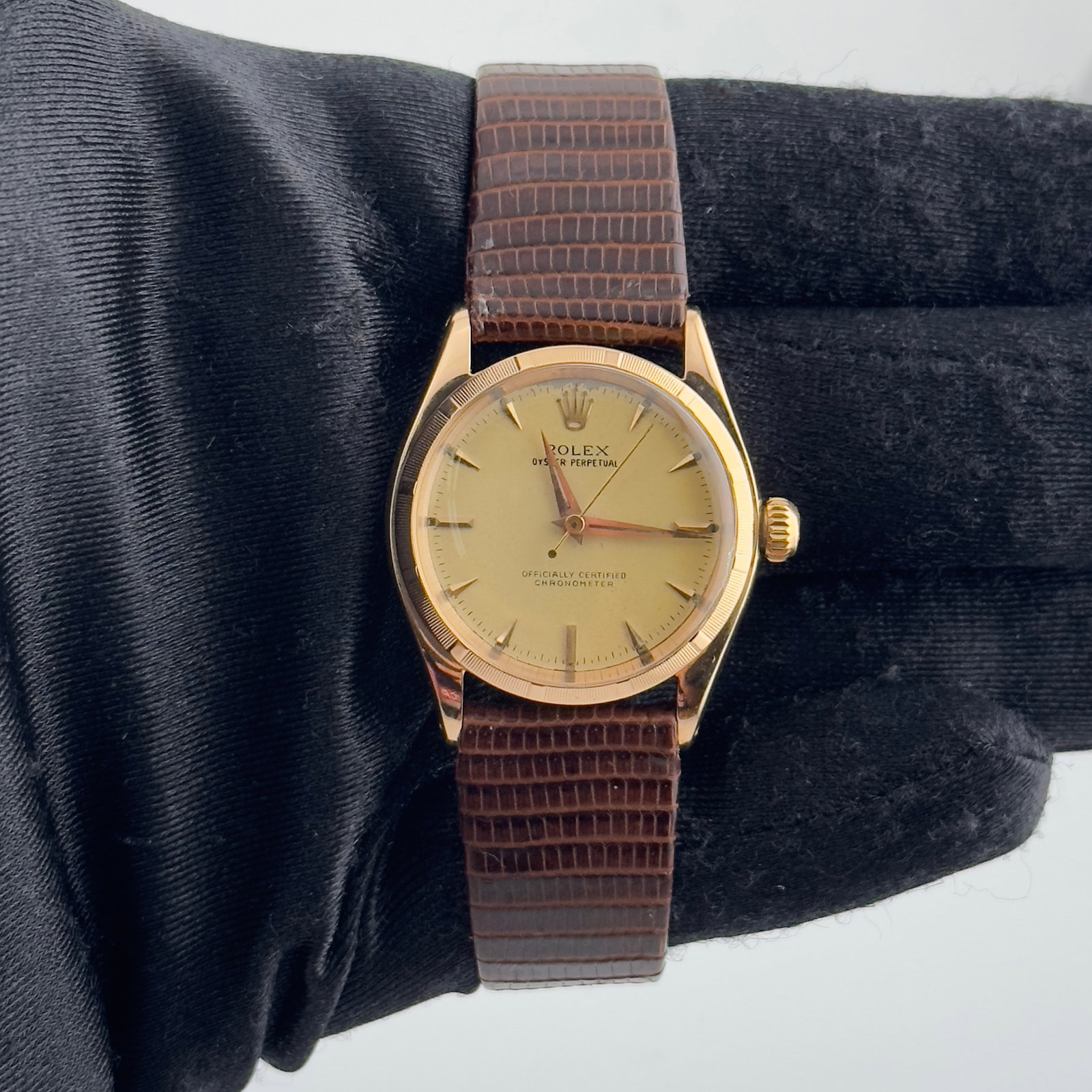 Ladies Oyster Perpetual Ref 6549 Champagne Dial Watch on Aftermarket Leather Strap: Ladies Oyster Perpetual Ref 6549 Champagne Dial Watch on Aftermarket Leather Strap This ladies' Rolex Oyster Perpetual features a champagne stick dial and an engine turned bezel. The watch is paired w