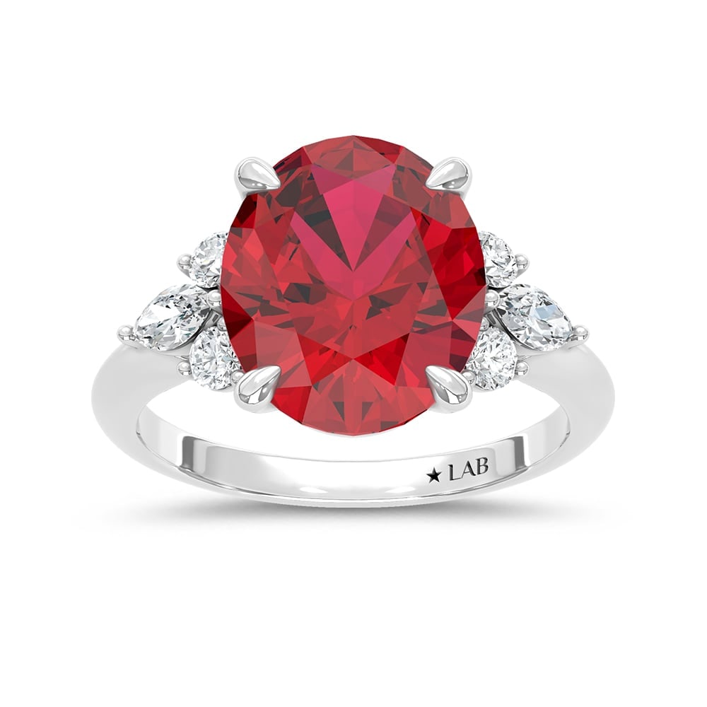 14K White Gold Lab Grown Diamond 7 1/8 Ct.Tw. Oval Shape Recrystalized Ruby Engagement Ring (Center: 14K White Gold Lab Grown Diamond 7 1/8 Ct.Tw. Oval Shape Recrystalized Ruby Engagement Ring (Center 6 5/8 ct) Exude unmatched elegance with this 14K white gold engagement ring. Its centerpiece is a ma
